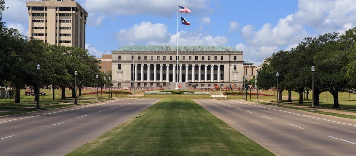 The main entrance to Texas A & M University with the Jack K. Williams Systems Administration building at the end of road in College Station, Texas