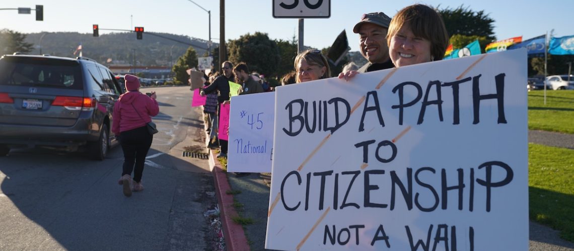 Monterey, CA – February 18, 2019: Protesters demonstrating their opposition to President Trump’s declaration of a national emergency in order to move forward with his southern border wall construction