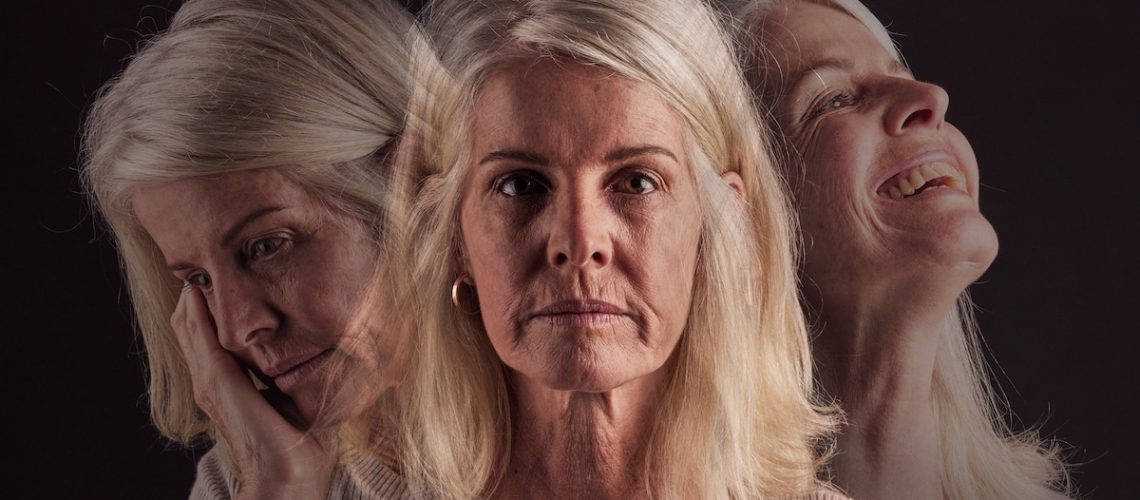 Senior woman, bipolar or mental health for depression, psychology or mood swings. Mature female, depressed or schizophrenia with identity crisis, trauma anxiety or problem with portrait, sad or smile