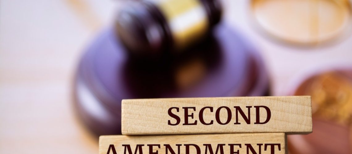 Wooden blocks with words 'Second Amendment'. Legal concept