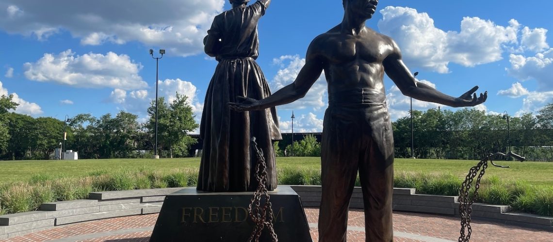 Richmond, Virginia USA - May 17, 2024: Emancipation and Freedom bronze statue at the canal walk on Brown's Island in Richmond, VA pays tribute to the end of slavery in the United States of America.