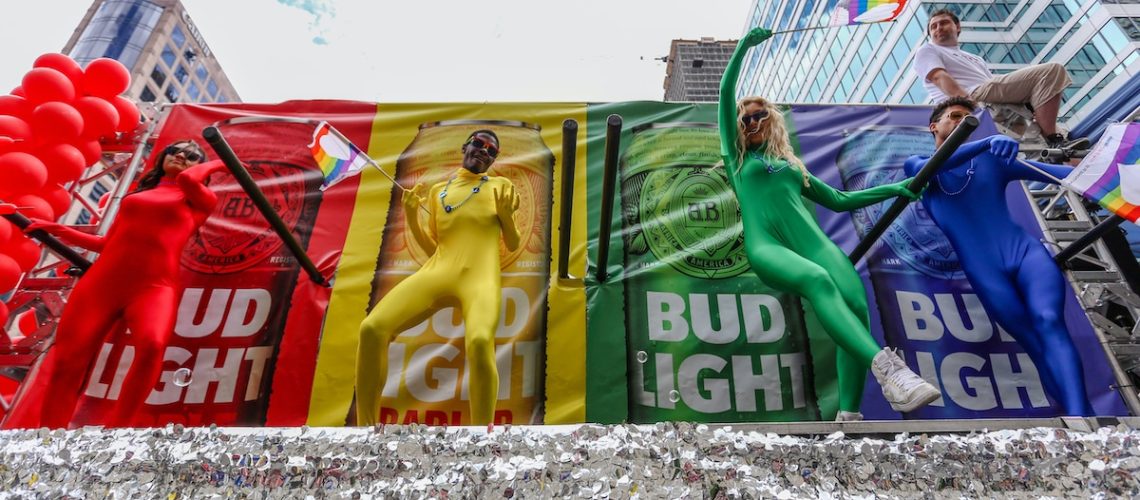 TORONTO, CANADA - JUNE 25, 2017: BUDWEISER employees on float dressed in different colour costumes at 2017 Toronto Pride Parade.